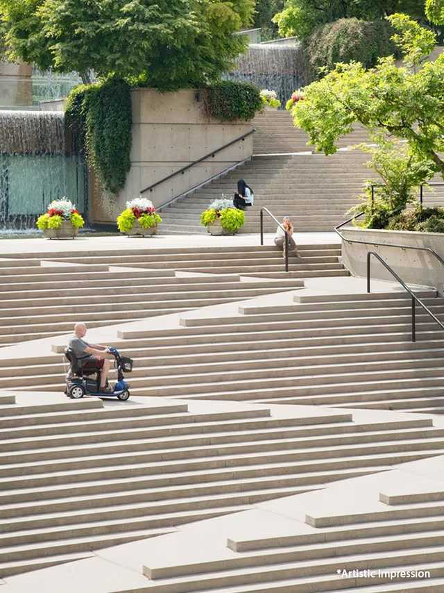 Person practising yoga in an open pavilion beside a reflecting pool